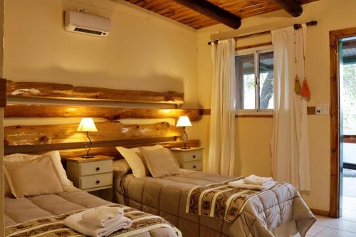 Una cama o camas en una habitación de Portal de La Cumbre