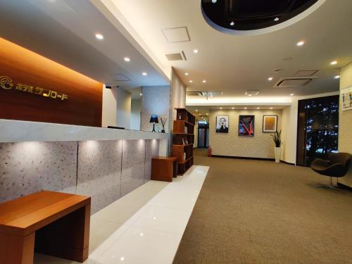 an office lobby with a reception desk and a waiting room at HOTEL SUNROAD - Vacation STAY 04184v in Amakusa