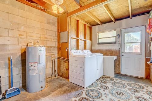 a laundry room with two washes and a washer and dryer at Sunshine Escape in Vero Beach