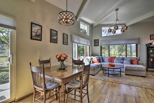 a living room with a table and a couch at Waterfront Troutdale Hideaway Sandy River Fishing in Troutdale