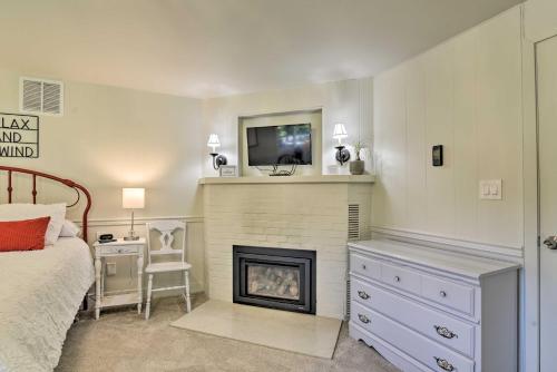 a bedroom with a fireplace and a bed and a tv at Waterfront Troutdale Hideaway Sandy River Fishing in Troutdale