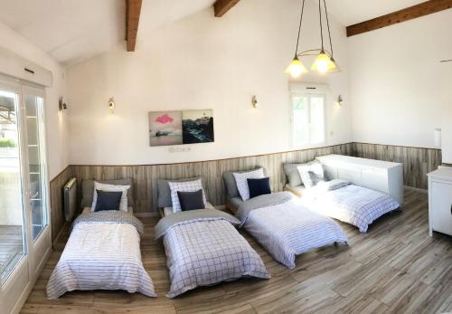 Ένα ή περισσότερα κρεβάτια σε δωμάτιο στο Team House - 8 lits