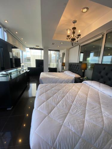 Giường trong phòng chung tại Departamento Penthouse en Salta Capital