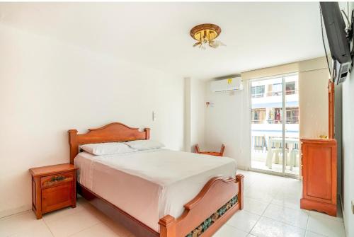 Postel nebo postele na pokoji v ubytování Apartamento karey 506