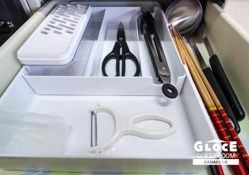 a drawer filled with kitchen utensils in a tray at GLOCE 鎌倉 若宮大路House お部屋から江ノ電ビューを独り占め 鎌倉駅から徒歩3分 in Kamakura