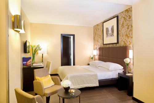 Un pat sau paturi într-o cameră la Starhotels Majestic