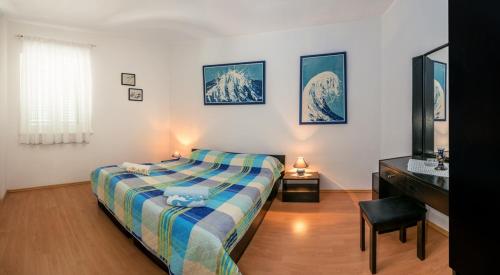 a bedroom with a bed and a sink in it at Apartments and rooms with parking space Bol, Brac - 15418 in Bol