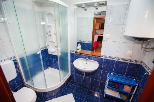 a bathroom with a sink and a shower and a toilet at Apartments with WiFi Hvar - 15506 in Hvar