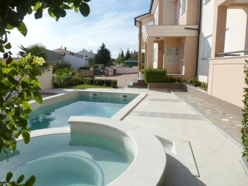 Family friendly apartments with a swimming pool Vinkuran, Pula - 15736