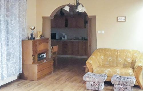 a living room with a couch and a table at Gorgeous Home In Postomino With Wifi in Postomino