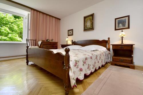 a bedroom with a large bed and a window at Seaside holiday house Baska Voda, Makarska - 16138 in Baška Voda