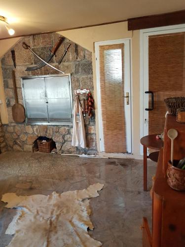 a room with a damaged floor and a stone wall at Studio Baric Draga 16148b in Barić Draga
