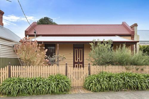 a wooden fence in front of a house at Large House on Wharf Street in Queenscliff