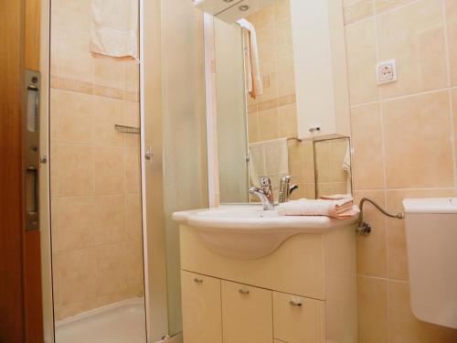 a bathroom with a sink and a shower at Apartments by the sea Karbuni, Korcula - 16286 in Prizba