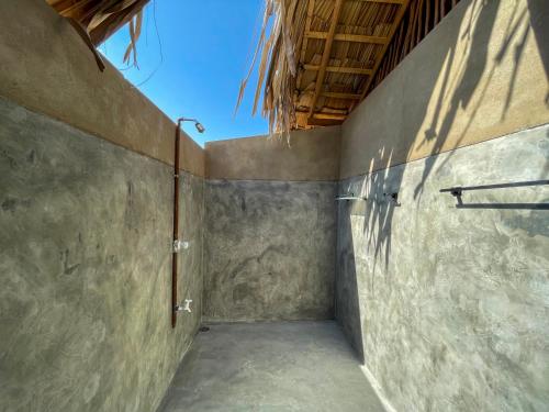 an empty room with a concrete wall and a ceiling at Yakaduru - Yala in Yala