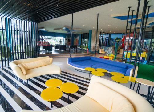 a living room with a pool in the middle at Solea Mactan Resort in Mactan