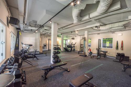 a gym with lots of exercise equipment in a room at Amara Sanctuary Sentosa in Singapore