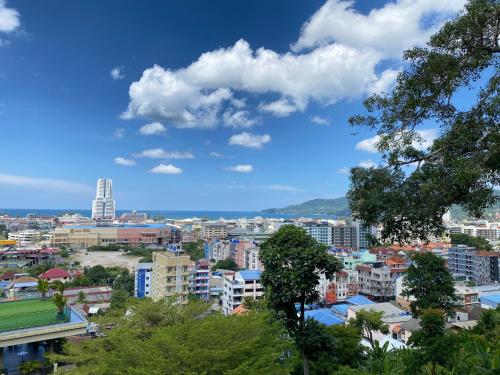a view of a city with buildings and trees at The Senses Resort & Pool Villas, PHUKET in Patong Beach
