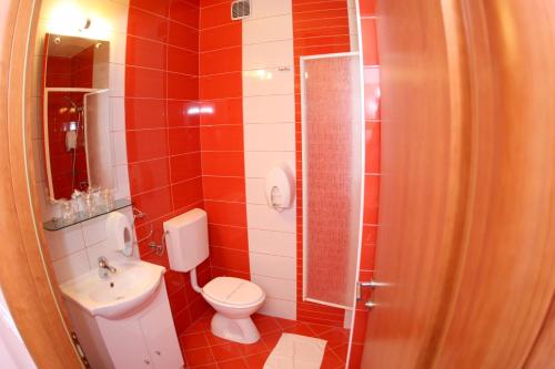 a small bathroom with a toilet and a sink at Rooms with a parking space Oroslavje, Zagorje - 15384 in Oroslavje