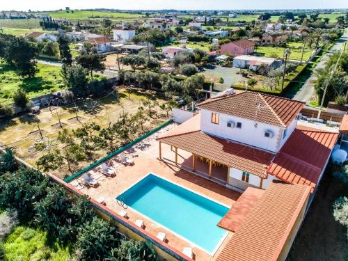 an aerial view of a house with a swimming pool at Reel Paradise Villa, Cyprus in Larnaca