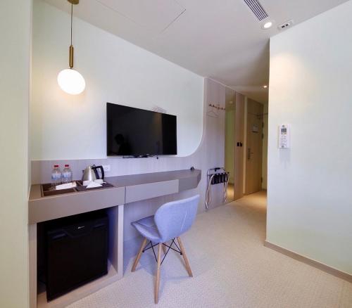 TV a/nebo společenská místnost v ubytování Hai Fu Hotel & Suites