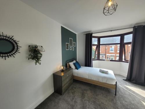 a bedroom with a bed and a window at Luke Stays - Parsons Gardens in Dunston