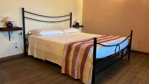 Postel nebo postele na pokoji v ubytování Agriturismo I Pietrini