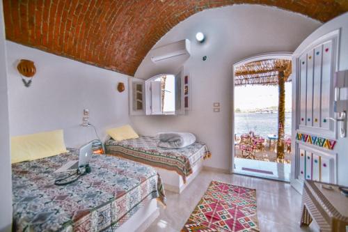Cama o camas de una habitación en Kafana Guest House Nile View