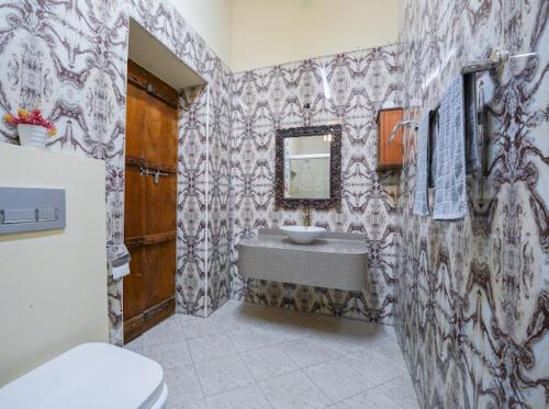 a bathroom with a sink and a toilet in it at Heritage Home Guest House in Dubai