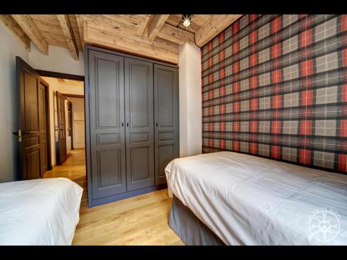 Ένα ή περισσότερα κρεβάτια σε δωμάτιο στο CASA VINYETA de Alma de Nieve
