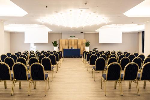 an empty room with chairs and a podium at Best Western CTC Hotel Verona in San Giovanni Lupatoto