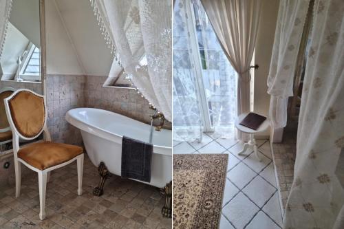 uma casa de banho com uma banheira e uma cadeira ao lado de uma janela em Villa Toscana Boutique em Murzasichle