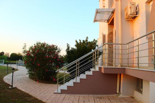 a staircase on the side of a building at VILLA DIAMOND Κουρούτα Αμαλιαδος in Amaliás