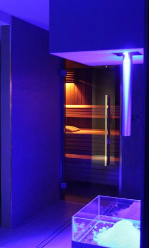a purple room with a room with a bed in it at Hotel 4 Venti spa & wellness in Sestri Levante