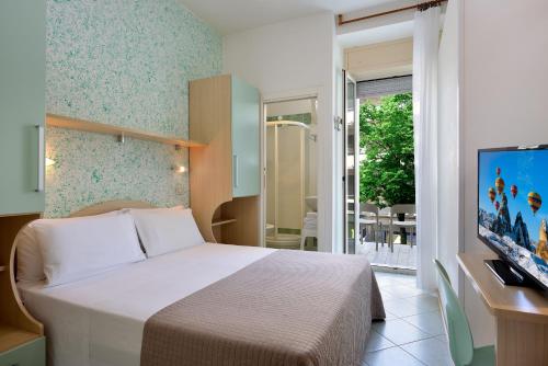 Postel nebo postele na pokoji v ubytování Hotel Romagna
