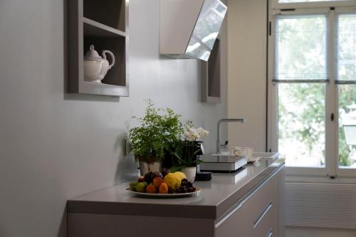 a kitchen with a plate of fruit on a counter at Mocenigo Grand Canal Luxury Suites in Venice