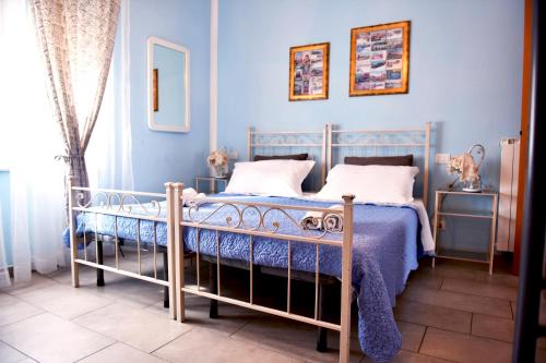 Postel nebo postele na pokoji v ubytování Nonna Anita Palace Narni