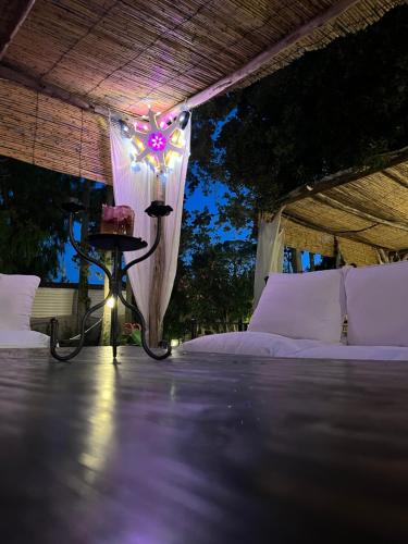a bedroom with a bed with a light on it at Baia Dei Micenei in Otranto