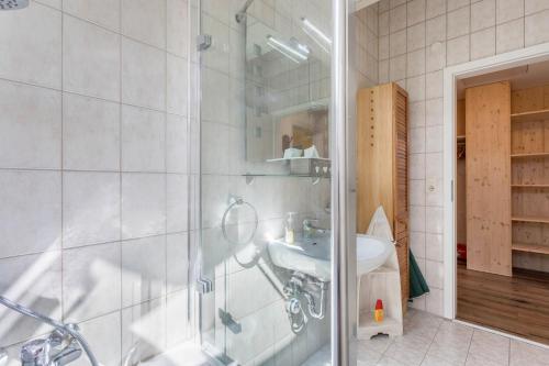 a bathroom with a shower and a sink at Zwischen Chiemsee und Bergen Dg in Bernau am Chiemsee