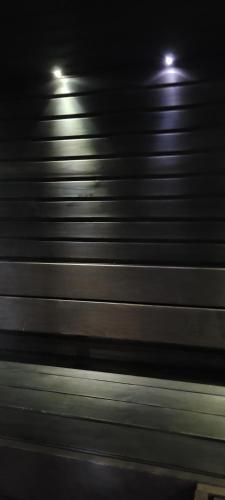 a blurry photo of a metal wall at night at Chalet Päämaja Rovaniemi in Rovaniemi