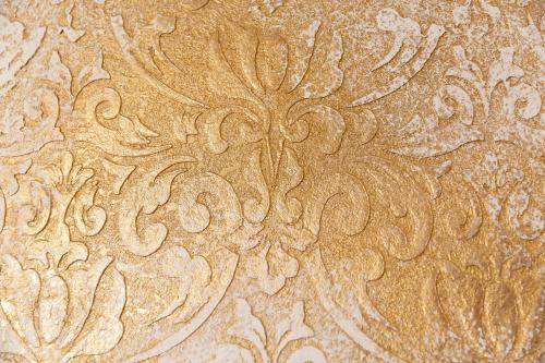 a close up of a wall with a flower painted on it at Hotel Quisisana Terme in Abano Terme
