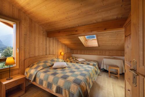Llit o llits en una habitació de Très beau chalet vue Mont-blanc