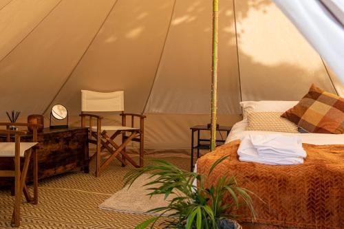 a bedroom with a bed in a tent at Three Tuns in Helston