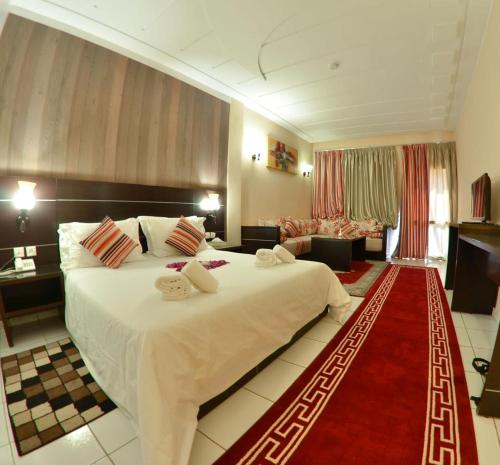 Ένα ή περισσότερα κρεβάτια σε δωμάτιο στο Hotel Al Akha