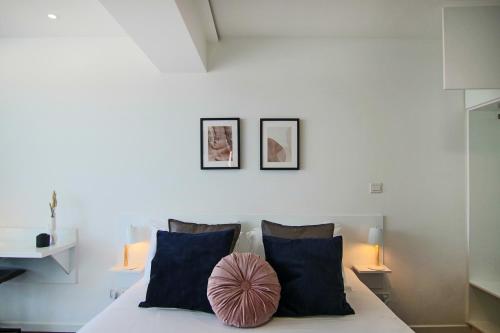 a bedroom with a bed with two pillows at Phaedrus Living: Luxury Suite Nicosia 505 in Nicosia