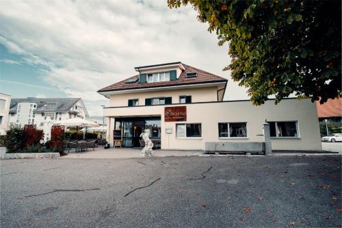 a dog standing in front of a building at Hotel Rössli Luterbach in Luterbach