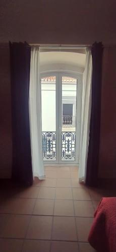 an open door with a view of a balcony at Residência D'Atalaia in Fronteira