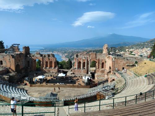 a view of the amphitheatre at the colosseum at Polifemo in Letojanni