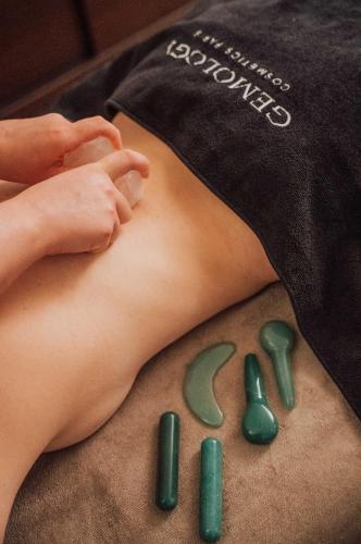 a person laying on the floor next to green pills at Manali Lodge by Alpine Resorts in Courchevel