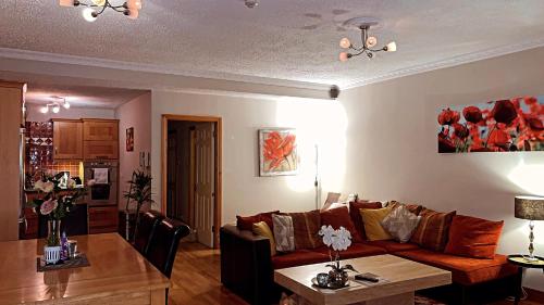 a living room with a couch and a table at Fernway Residence entire property in Cork
